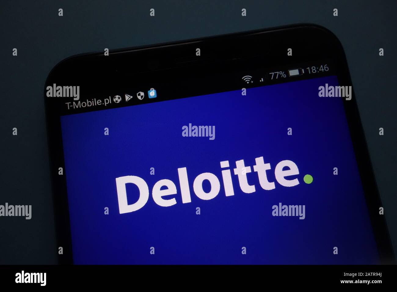 Deloitte logo on smartphone Stock Photo