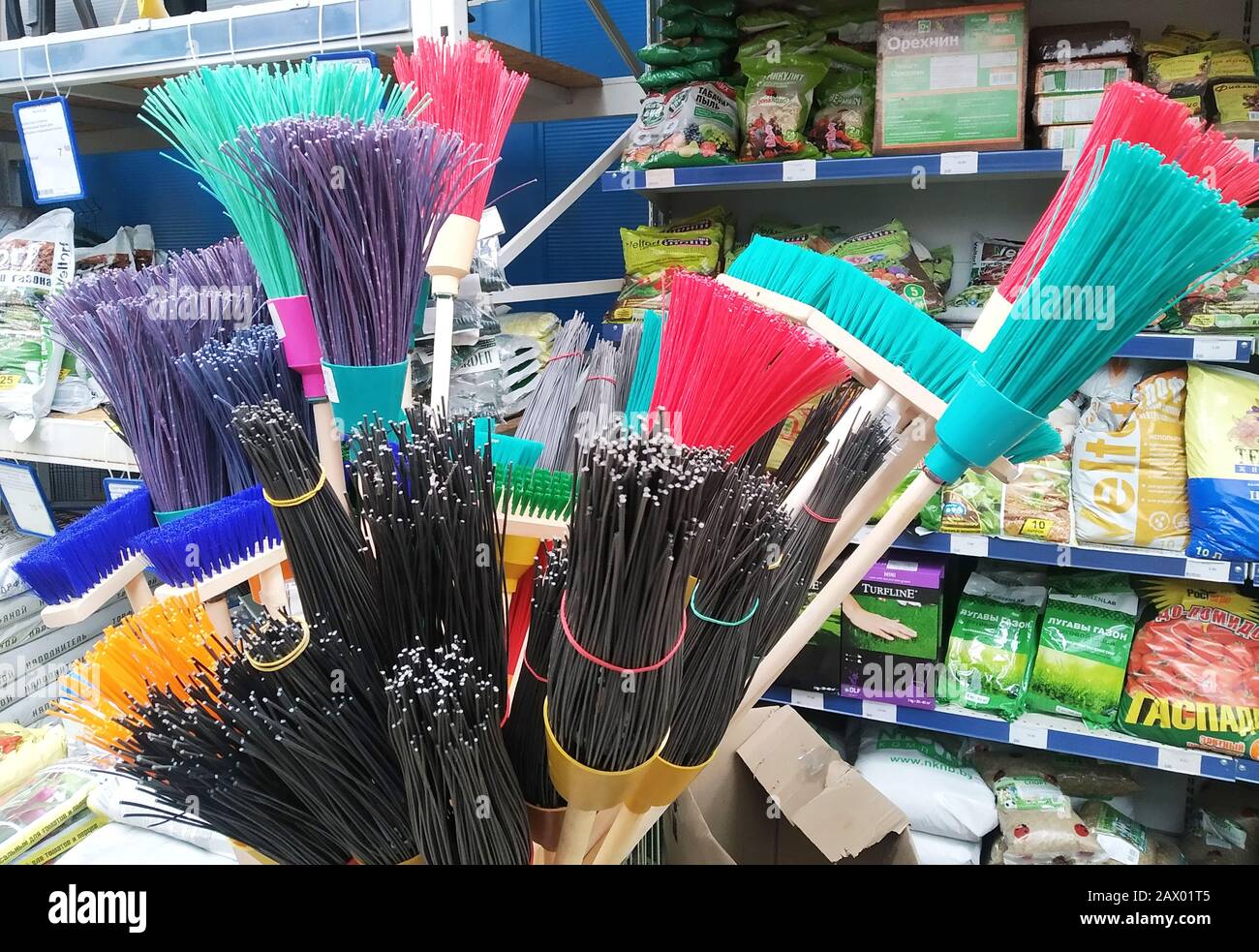 Bobruisk Belarus 19.09.2019: sale of multi-colored brooms for sweeping houses and streets, background Stock Photo