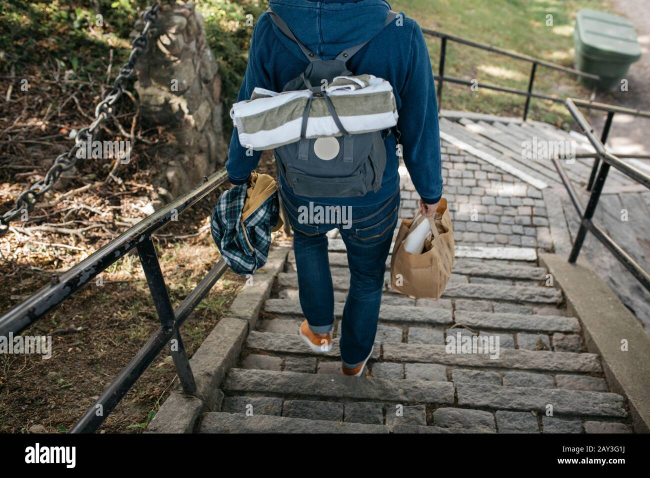 Man walking down steps Stock Photo