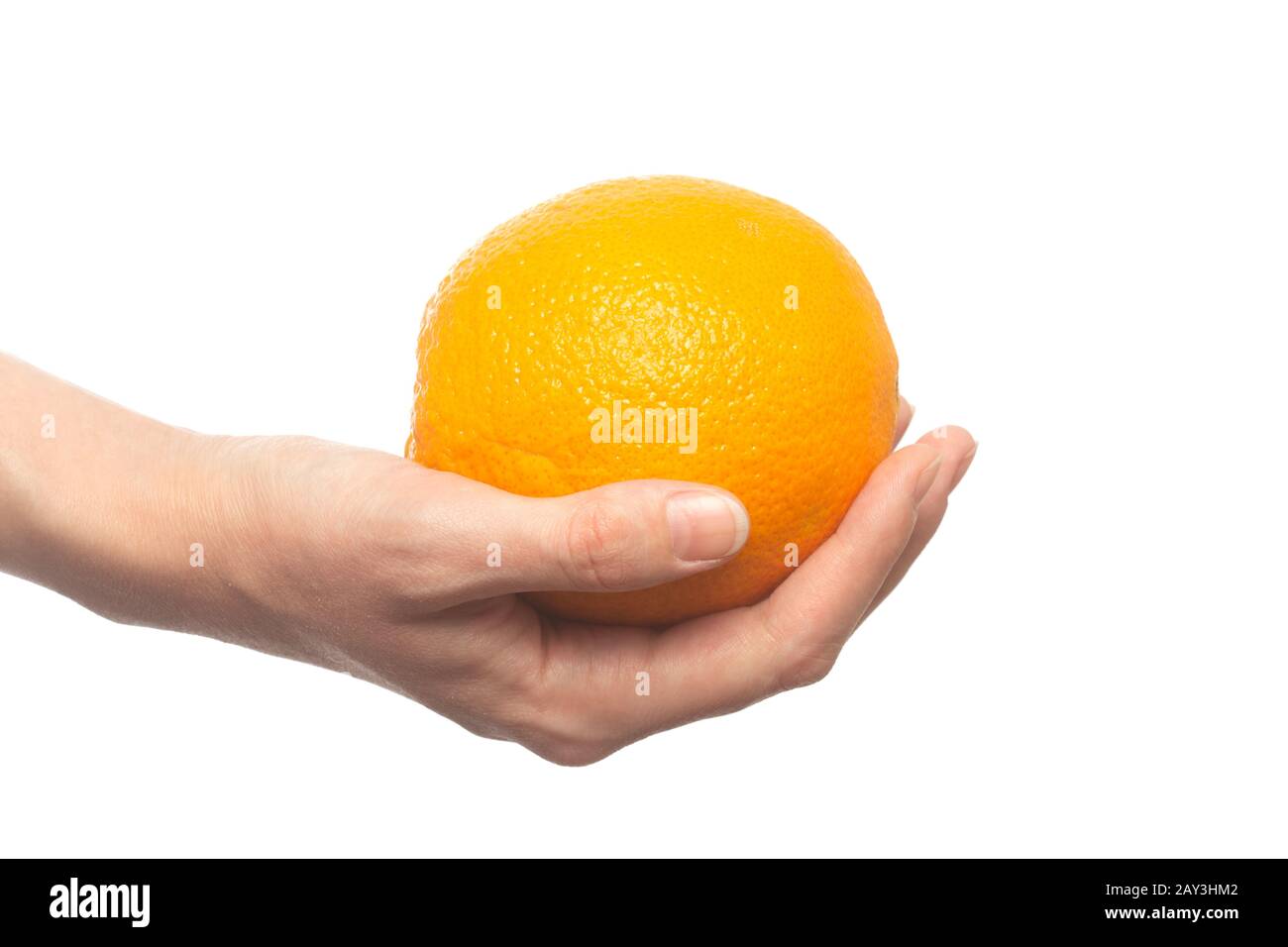 female hand with fresh orange fruit isolated on white background closeup view Stock Photo