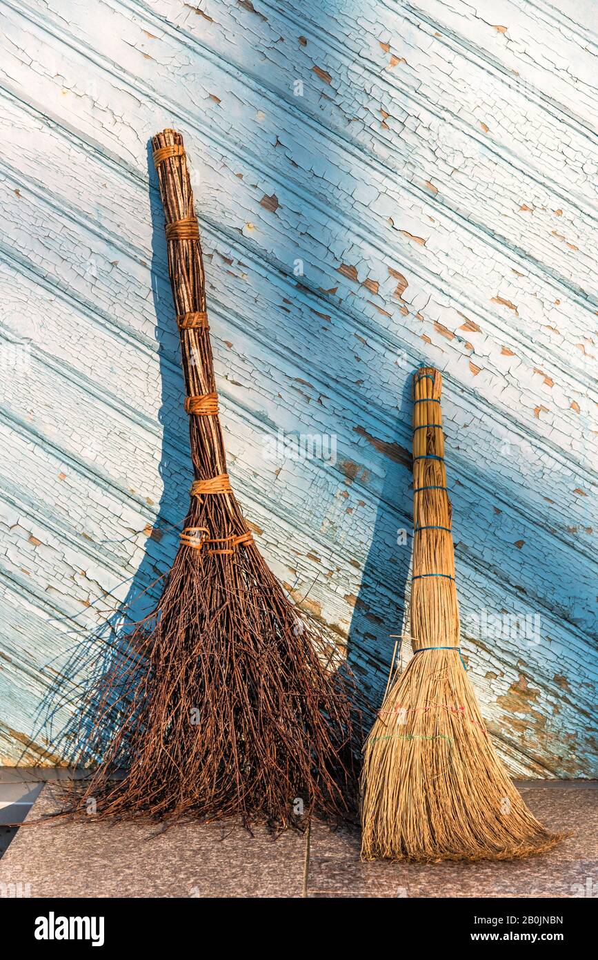 old and new brooms Stock Photo