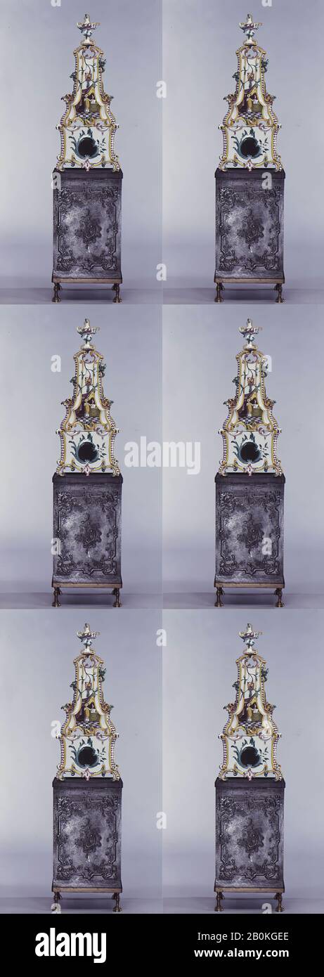 Ceramic stove on cast-iron firebox (one of a pair), German, Stockelsdorf, 1773, German, Stockelsdorf, Tin-glazed earthenware, gilt (worn), H. of oven 43 1/2 in. (110.5 cm); H. of firebox 35 1/2 in. (90.2 cm), Ceramics-Pottery Stock Photo