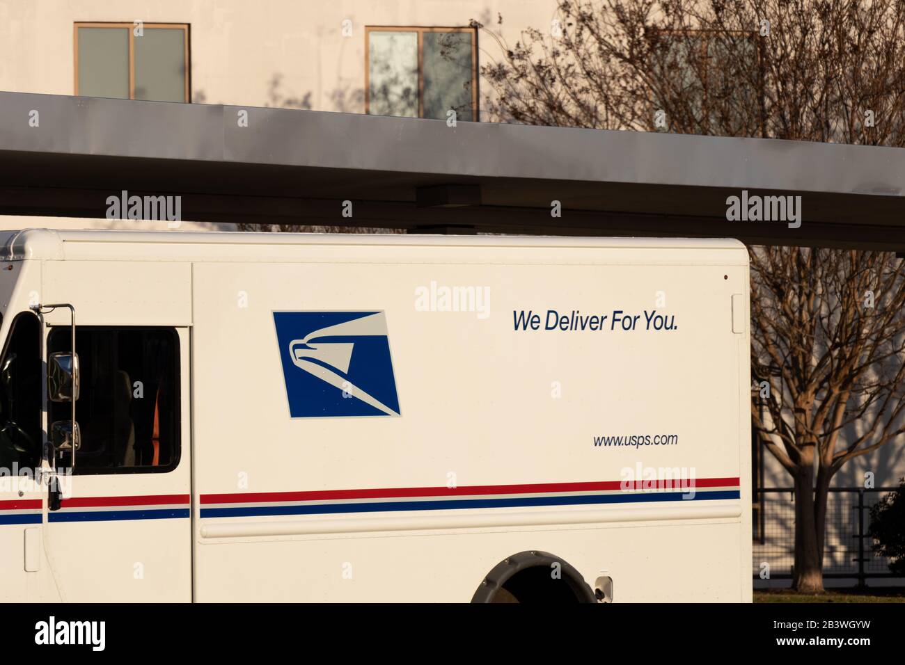 United States Postal Service (USPS) logo on a van parked at Reagan National Airport. Stock Photo