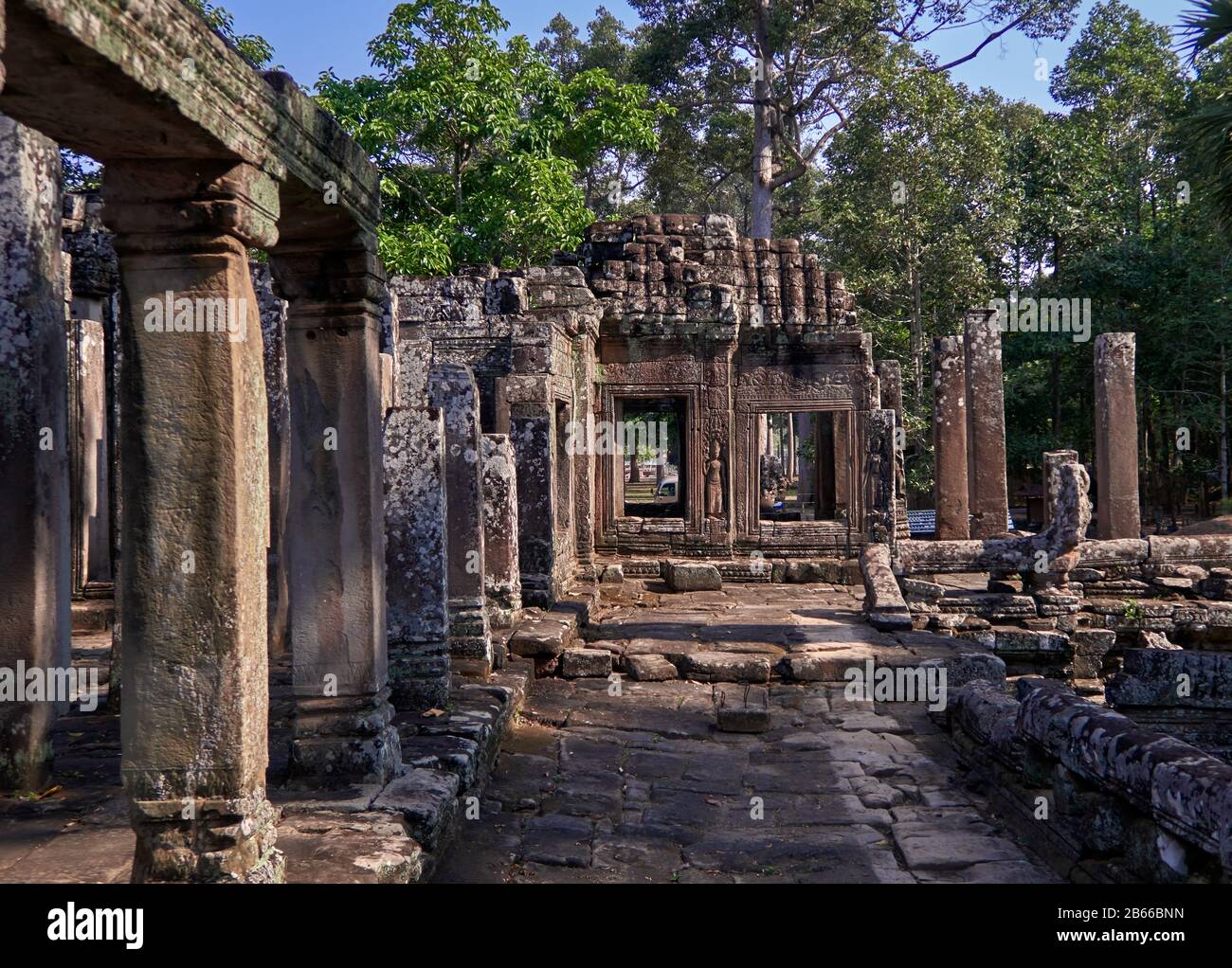 pink sandstone,The magnificent Bayon Temple situated within the last capital city of the Khmer Empire - Angkor Thom. Its 54 gothic towers are decorated with 216 enormous smiling faces. Built in the late 12th or early 13th century as the official state temple of the King Jayavarman VII. Stock Photo