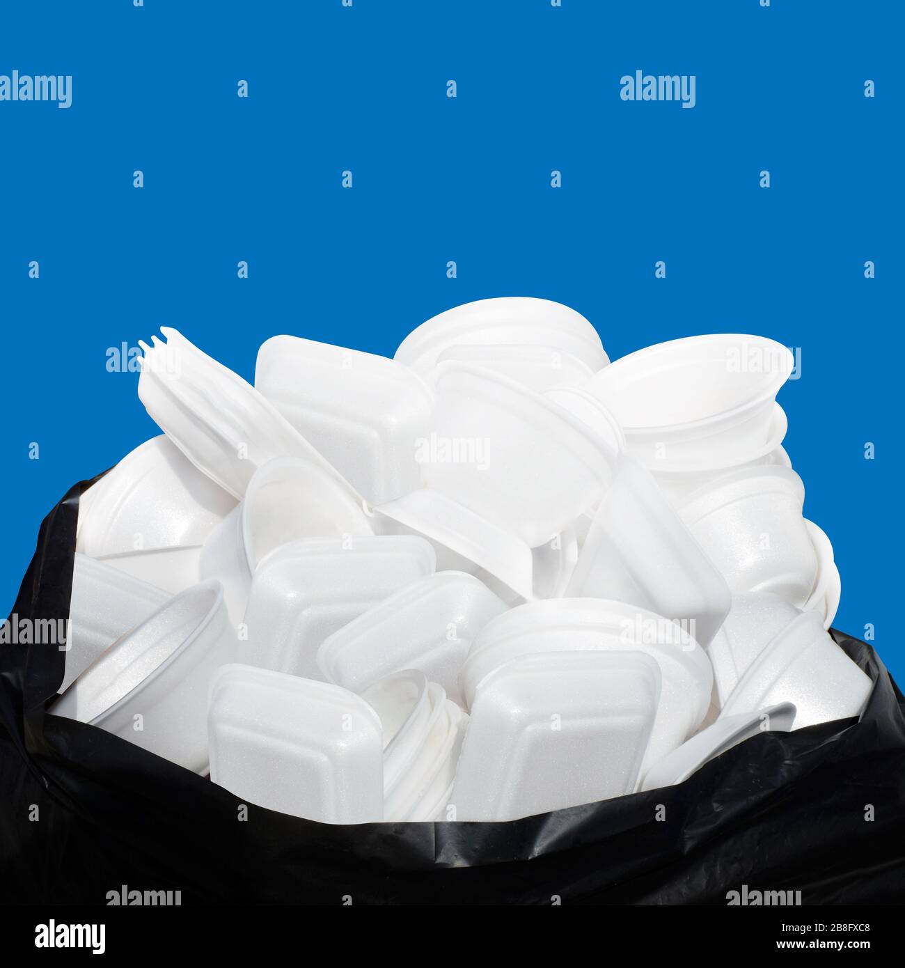 Waste Garbage foam food tray white many pile on the plastic black bag dirty isolated on blue background, Bin, Trash, Recycle, foam trays garbage isola Stock Photo