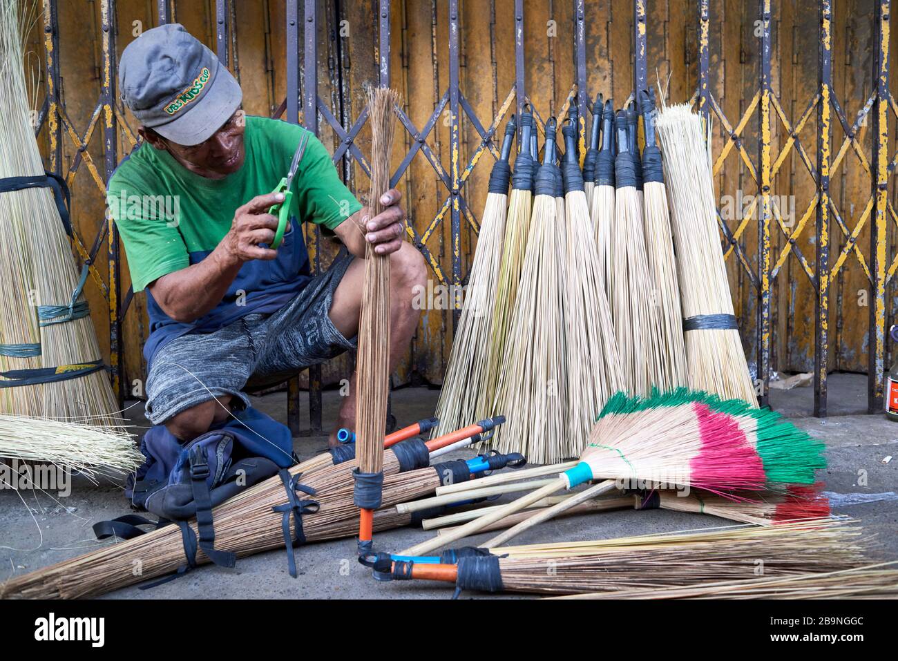 Man making brooms in the streets of the Carbon public market. Stock Photo