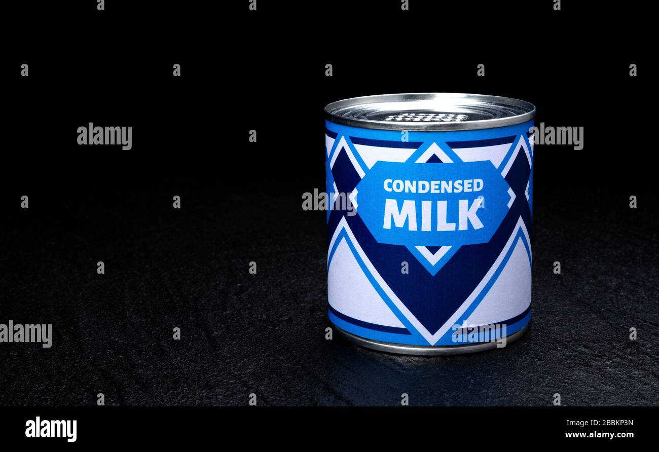 Condensed milk can on black background Stock Photo