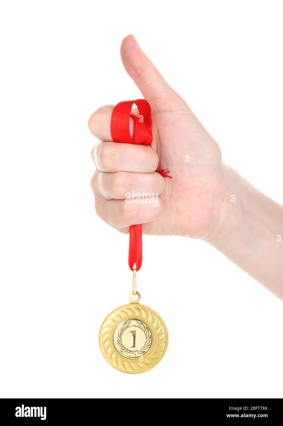 Gold medal in hand isolated on white Stock Photo