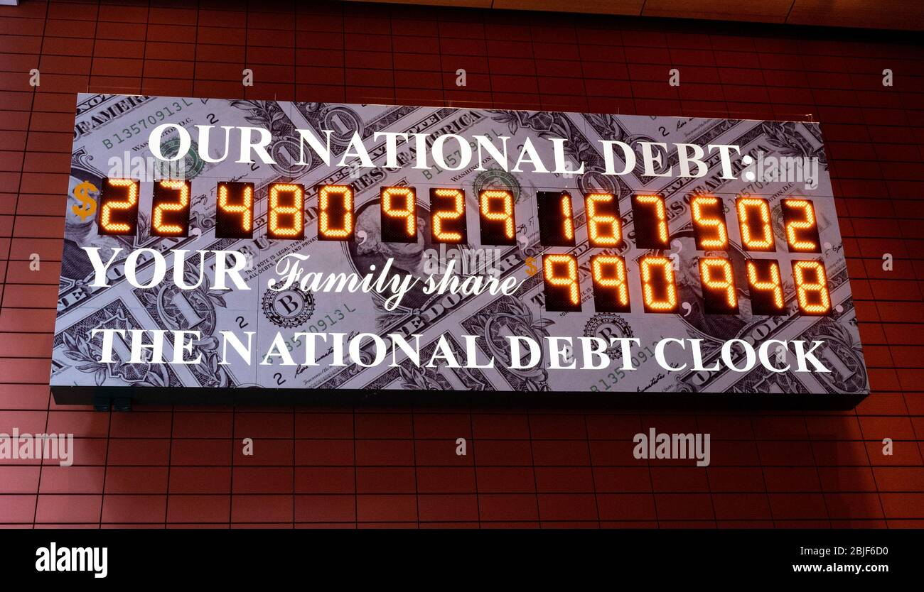 New York, U.S. 29th Apr, 2020. April 29, 2020 - New York, NY, United States: The National Debt Clock is a very very large digital display of the current gross national debt of the United States. It is mounted on a western facing wall in a wide covered alley in the middle of the block and runs between West 42nd Street and West 43rd Street. The alley is located between Sixth Avenue and Broadway in New York City. The displayed debt shown is as of April 29, 2020 when this image was created. (Photo by Michael Brochstein/Sipa USA) Credit: Sipa USA/Alamy Live News Stock Photo