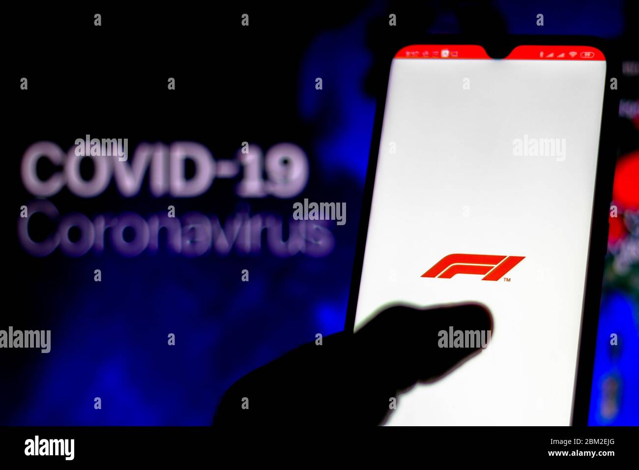 Brazil. 6th May, 2020. In this photo illustration the Formula One (F1) logo seen displayed on a smartphone with a computer model of the COVID-19 coronavirus in the background. Credit: Rafael Henrique/SOPA Images/ZUMA Wire/Alamy Live News Stock Photo