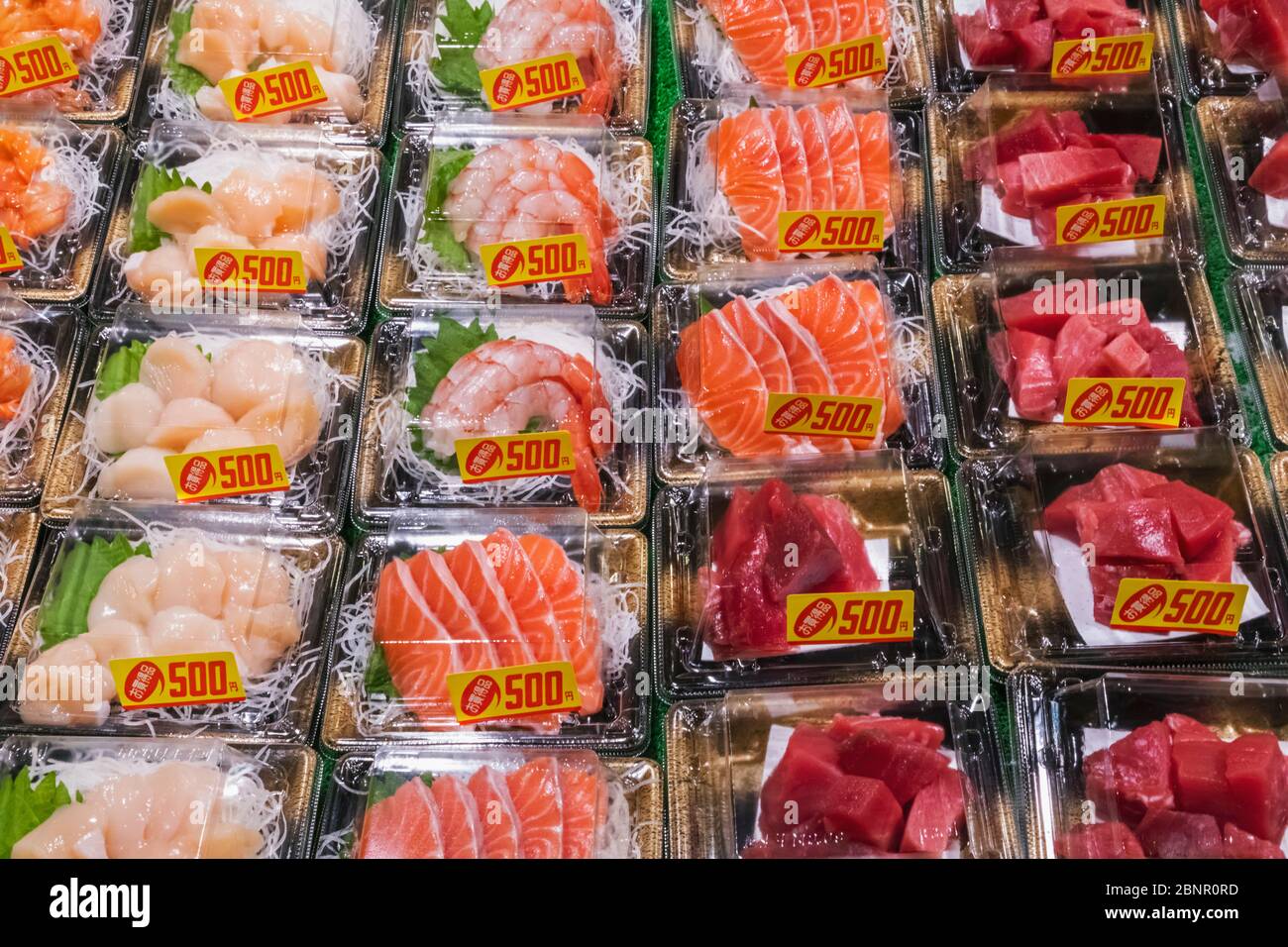 Japan, Honshu, Tokyo, Tsukiji, Tsukiji Outer Market, Seafood Shop Display of Plastic Wrapped Sashimi Stock Photo