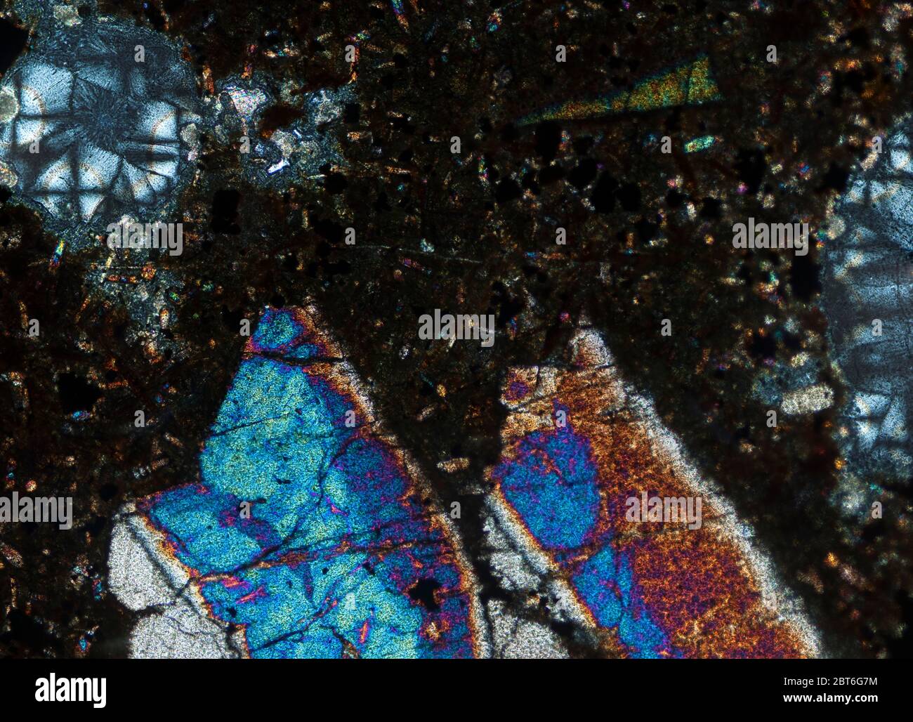 Limburgite thin section photographed in cross polarised light Stock Photo