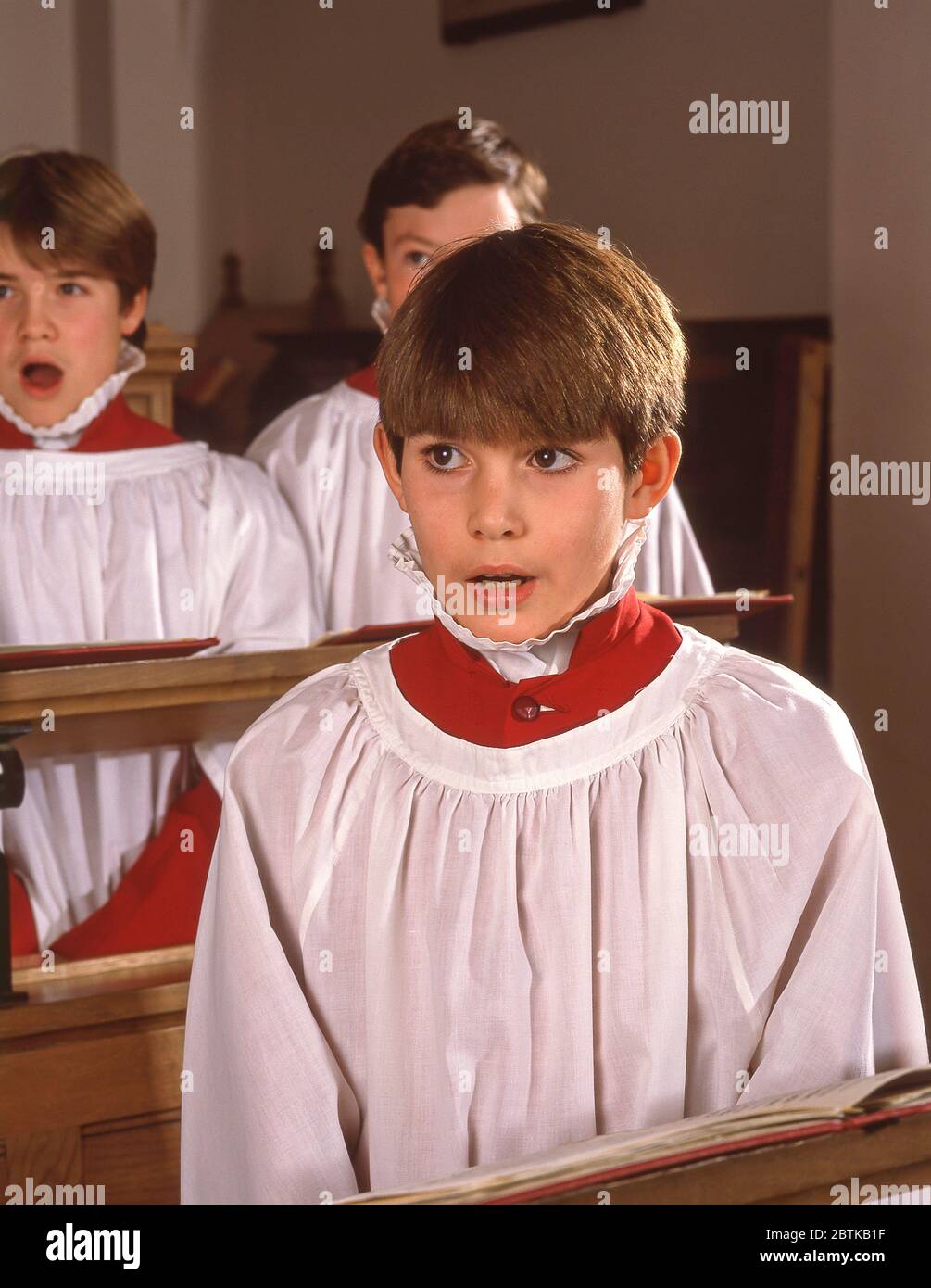 Young boy singer in church choir, Guildford, Surrey, England, United Kingdom Stock Photo