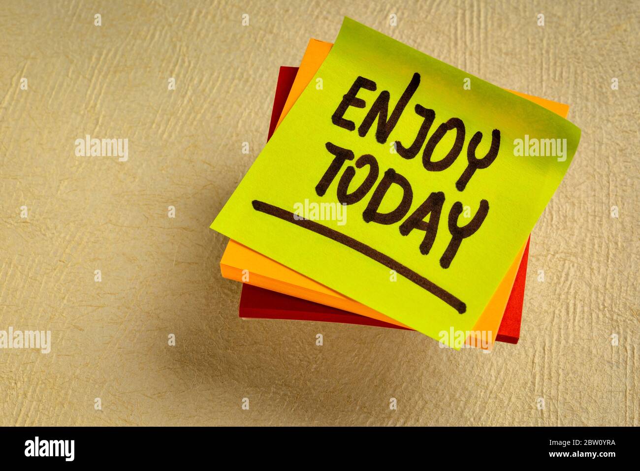 Enjoy today reminder - handwriting on a sticky note, positive attitude and mindset concept Stock Photo