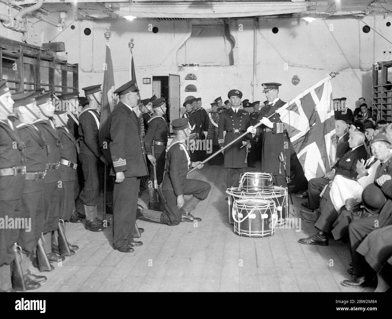 Vice Admiral R.M. Coloin receives the colours on TS Warspite 18th April 1934 Stock Photo