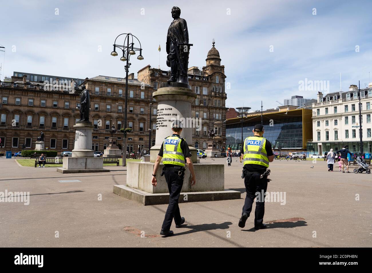 Glasgow, Scotland, UK. 12 June 2020. Police patrol George Square in the city centre to prevent vandalism to the many historic statues located here. Following the recent Black Lives Matter demonstrations in the UK,  many colonial era statues have been targeted by protestors.  Iain Masterton/Alamy Live News Stock Photo