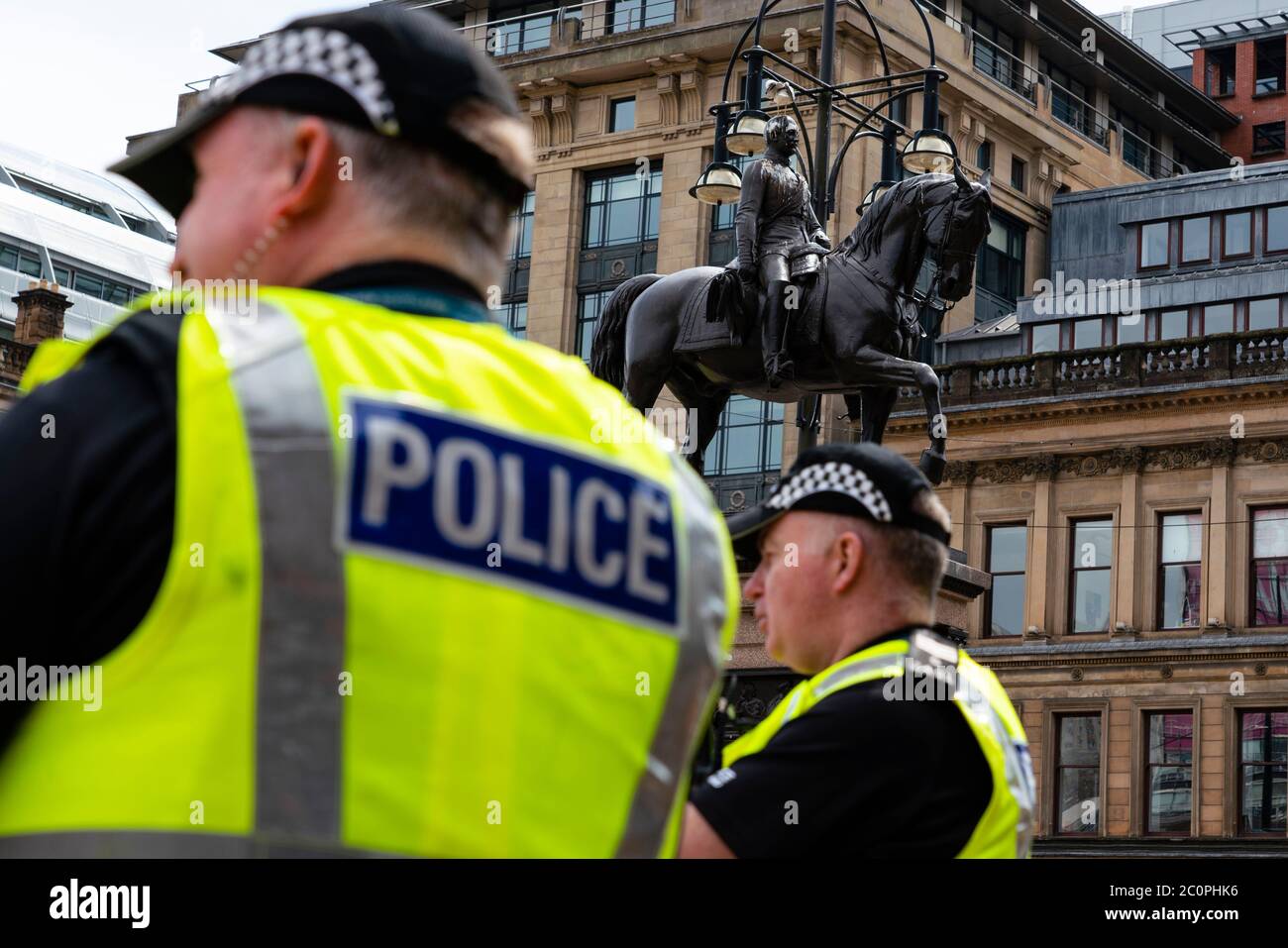 Glasgow, Scotland, UK. 12 June 2020. Police patrol George Square in the city centre to prevent vandalism to the many historic statues located here. Following the recent Black Lives Matter demonstrations in the UK,  many colonial era statues have been targeted by protestors.  Iain Masterton/Alamy Live News Stock Photo