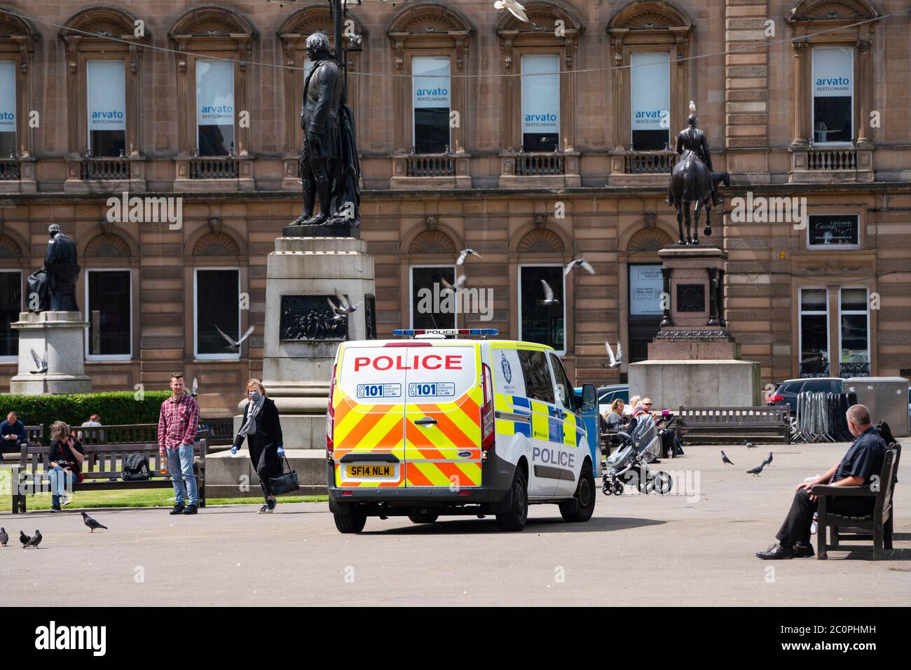 Glasgow, Scotland, UK. 12 June 2020. Police patrol George Square in the city centre to prevent vandalism to the many historic statues located here. Following the recent Black Lives Matter demonstrations in the UK,  many colonial era statues have been targeted by protestors.  Iain Masterton/Alamy Live News Stock Photo