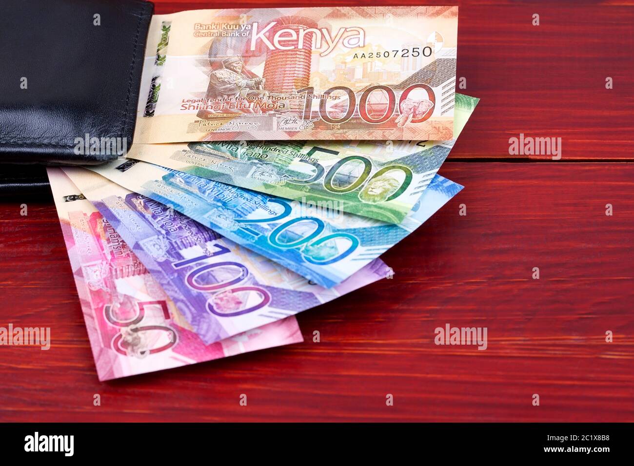 Kenyan Shillings in the black wallet Stock Photo