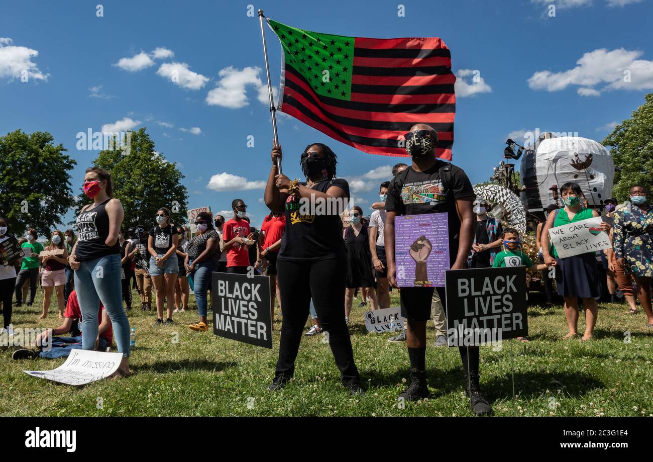 June 19, 2020, Boston, Massachusetts, USA: People celebrate Juneteenth with a stylized American Black Lives Matter flag during a Juneteeth rally in Boston. Juneteenth commemorates when the last enslaved African Americans learned in 1865 they were free, more than two years following the Emancipation Proclamation. Credit: Keiko Hiromi/AFLO/Alamy Live News Stock Photo