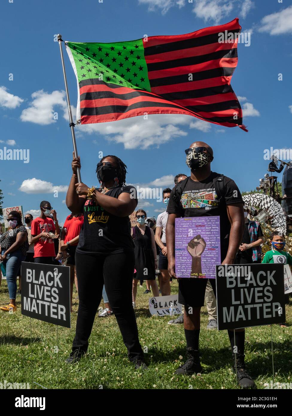 June 19, 2020, Boston, Massachusetts, USA: People celebrate Juneteenth with a stylized American Black Lives Matter flag during a Juneteeth rally in Boston. Juneteenth commemorates when the last enslaved African Americans learned in 1865 they were free, more than two years following the Emancipation Proclamation. Credit: Keiko Hiromi/AFLO/Alamy Live News Stock Photo