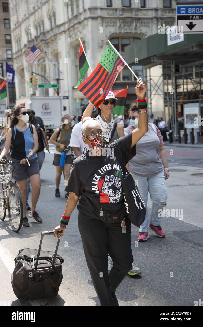 Demonstration and march near NYC City Hall on Juneteenth keeps up the pressure to end police brutality, especially against blacks, and to change the system to reflect true equality for all citizens. New York City. Stock Photo