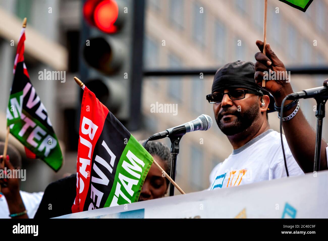 Musician in a go-go band playing on a truck driving through Black Lives Matter Plaza during Juneteenth celebrations Washington, DC, Unite Stock Photo