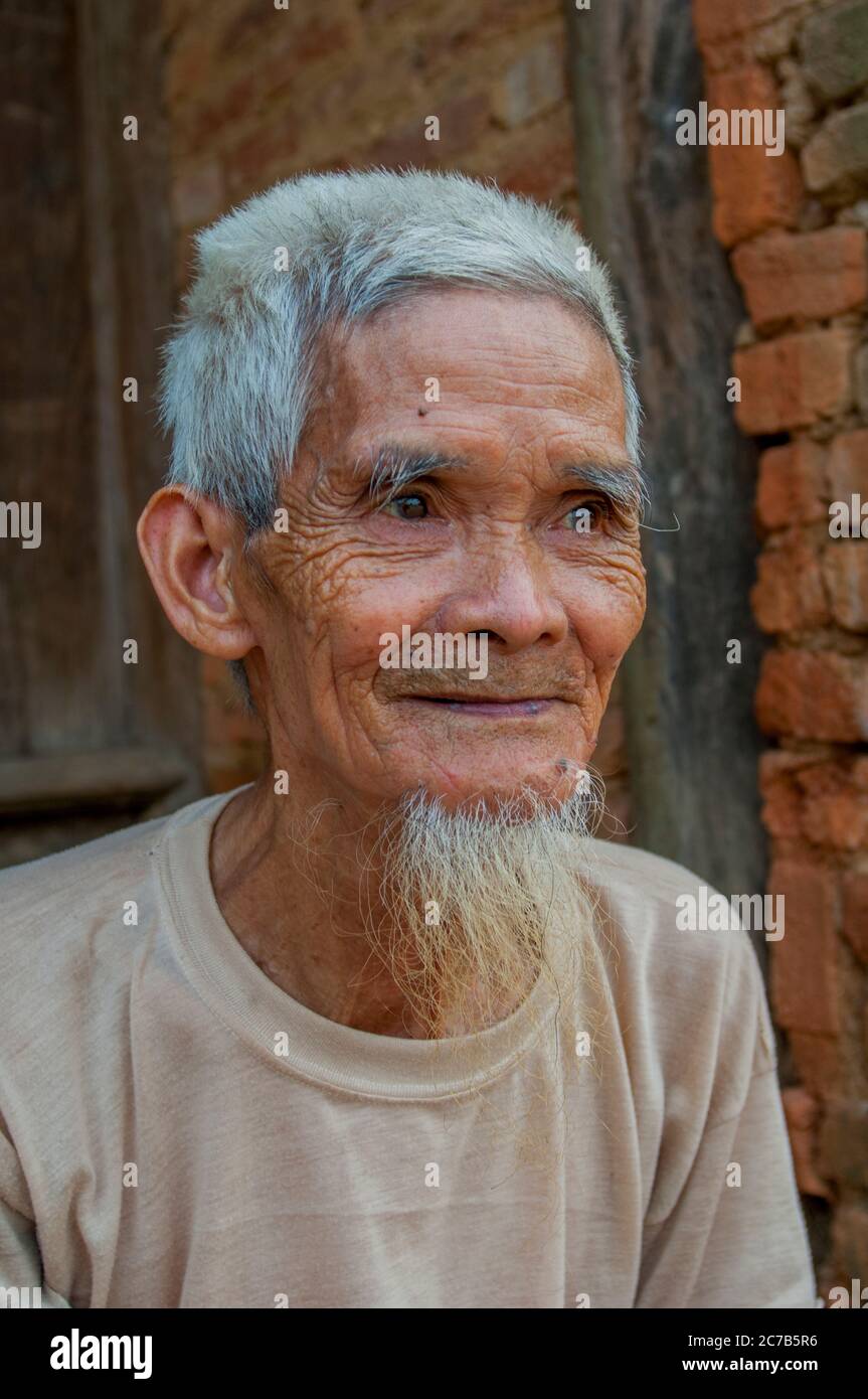 A portrait of an old farmer in a village near Hanoi in North Vietnam. Stock Photo