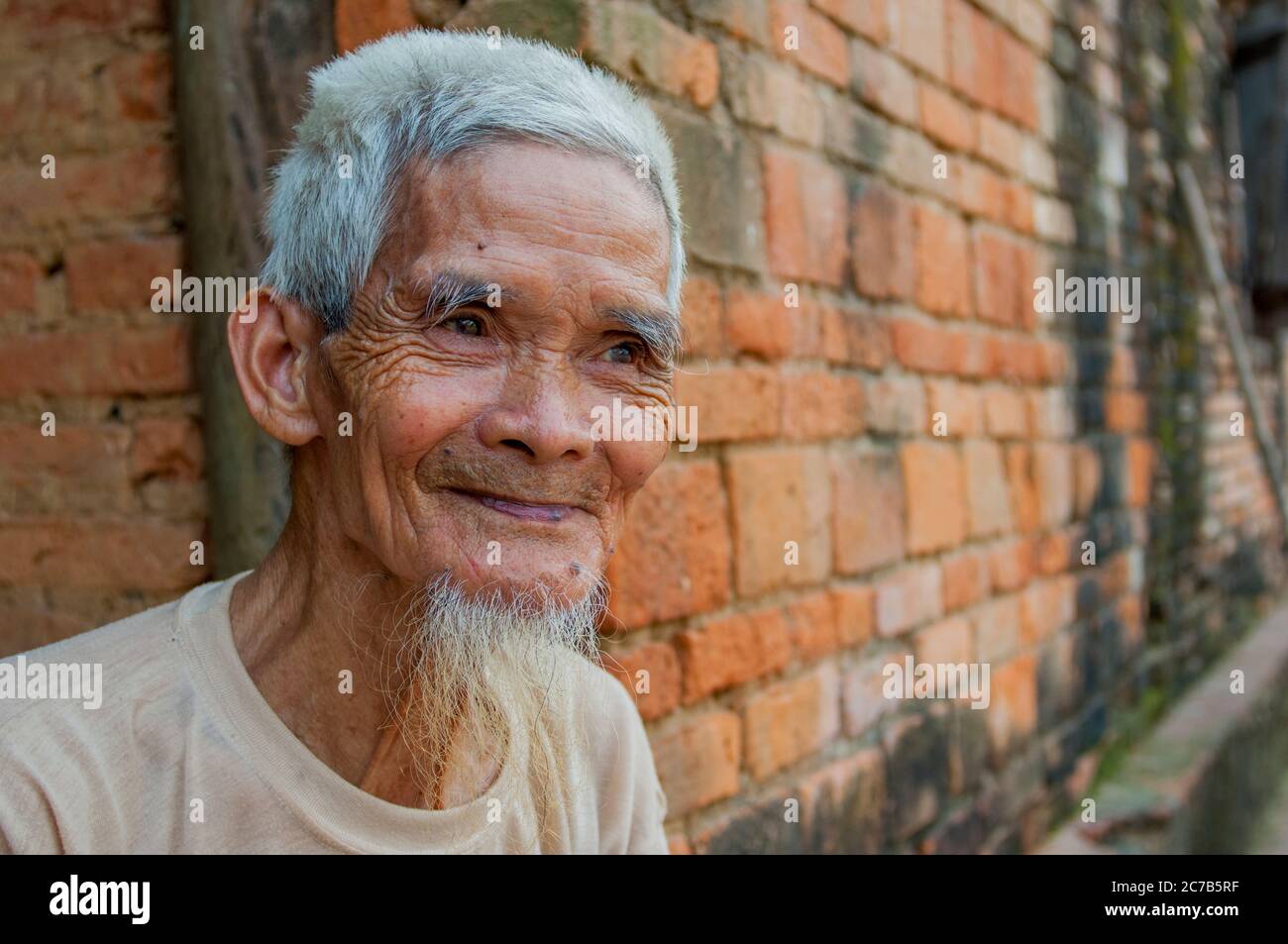 A portrait of an old farmer in a village near Hanoi in North Vietnam. Stock Photo