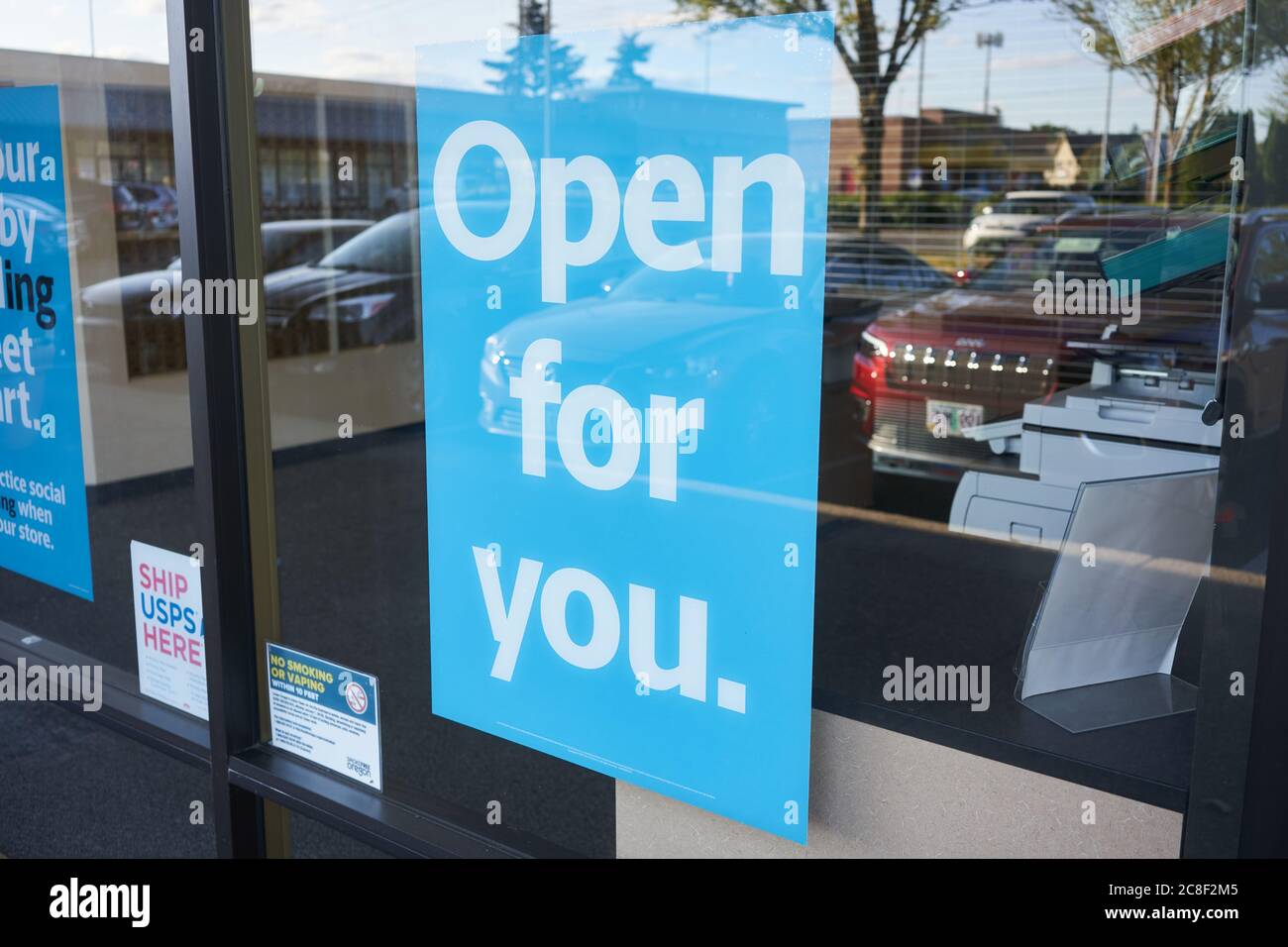 A big 'Open for you' sign is seen at a USPS (United States Postal Service) post office in Lake Oswego, Ore., on 7/22/2020, during the COVID-19 pandemic. Stock Photo