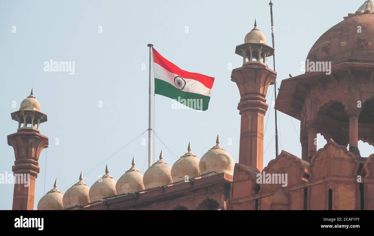 close up of the indian flag flying above red fort in old delhi Stock Photo