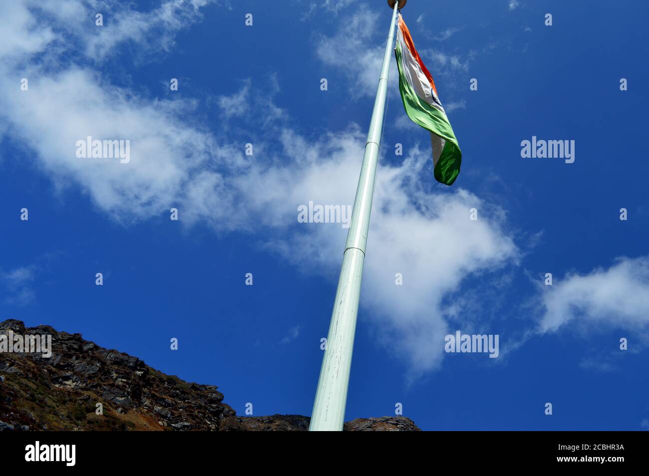 The Indian National flag flying high in the mountains of Nathula pass, Sikkim, selective focusing Stock Photo