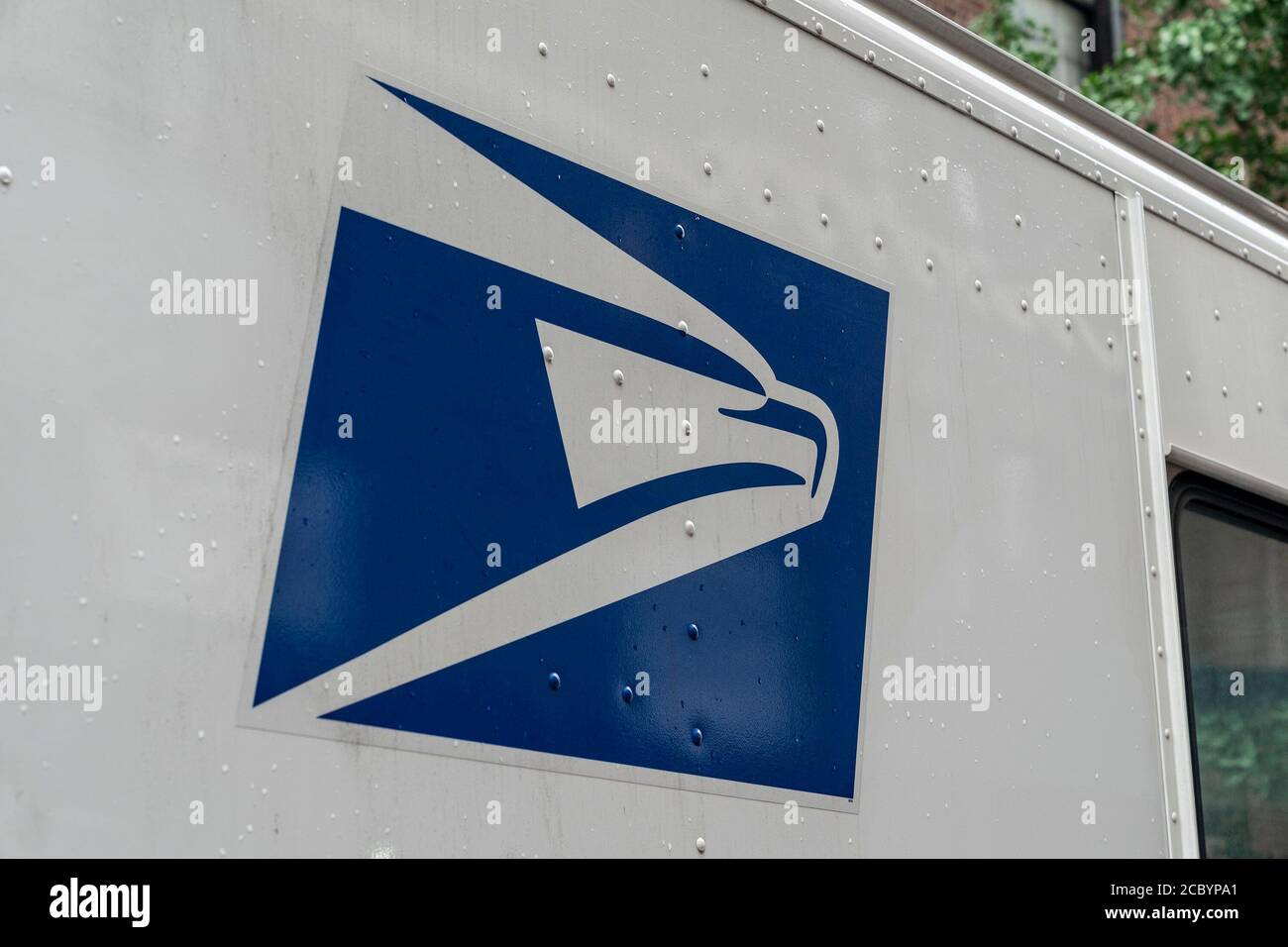 New York, United States. 16th Aug, 2020. USPS logo on delivery truck seen parked on the street in Chelsea. USPS cares all mail-in vote ballots during election time. Record number of people are expected to vote by mail due to the pandemic. President Donald Trump said that universal mail-in voting is going to be catastrophic, it's going to make our country the laughing stock of the world despite he himself and First Lady requested absentee ballots. (Photo by Lev Radin/Pacific Press) (Photo by Lev Radin/Pacific Press) Credit: Pacific Press Media Production Corp./Alamy Live News Stock Photo