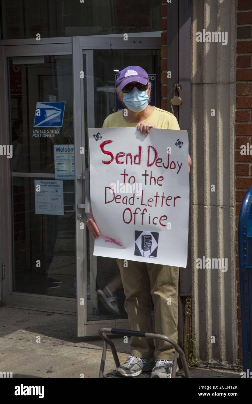 'Save The Post Office Saturday:' Protesters gather in front of nearly 800 Post offices around the country, like this one in Park SLope, Brooklyn, to  support postal workers, demand government funding for the USPS, also demanding the resignation of Postmaster General Louis DeJoy and stop the voter suppression campaign orchestrated by the Trump administration by stopping mail in voting. Stock Photo