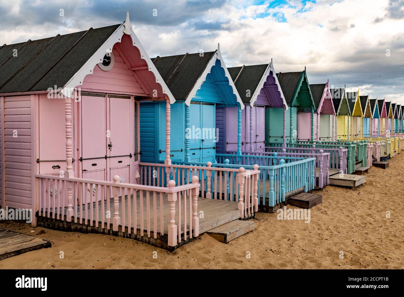 Beach huts on West Mersea beach .   West Mersea Beach, Mersea Island, Colchester, Essex. Stock Photo