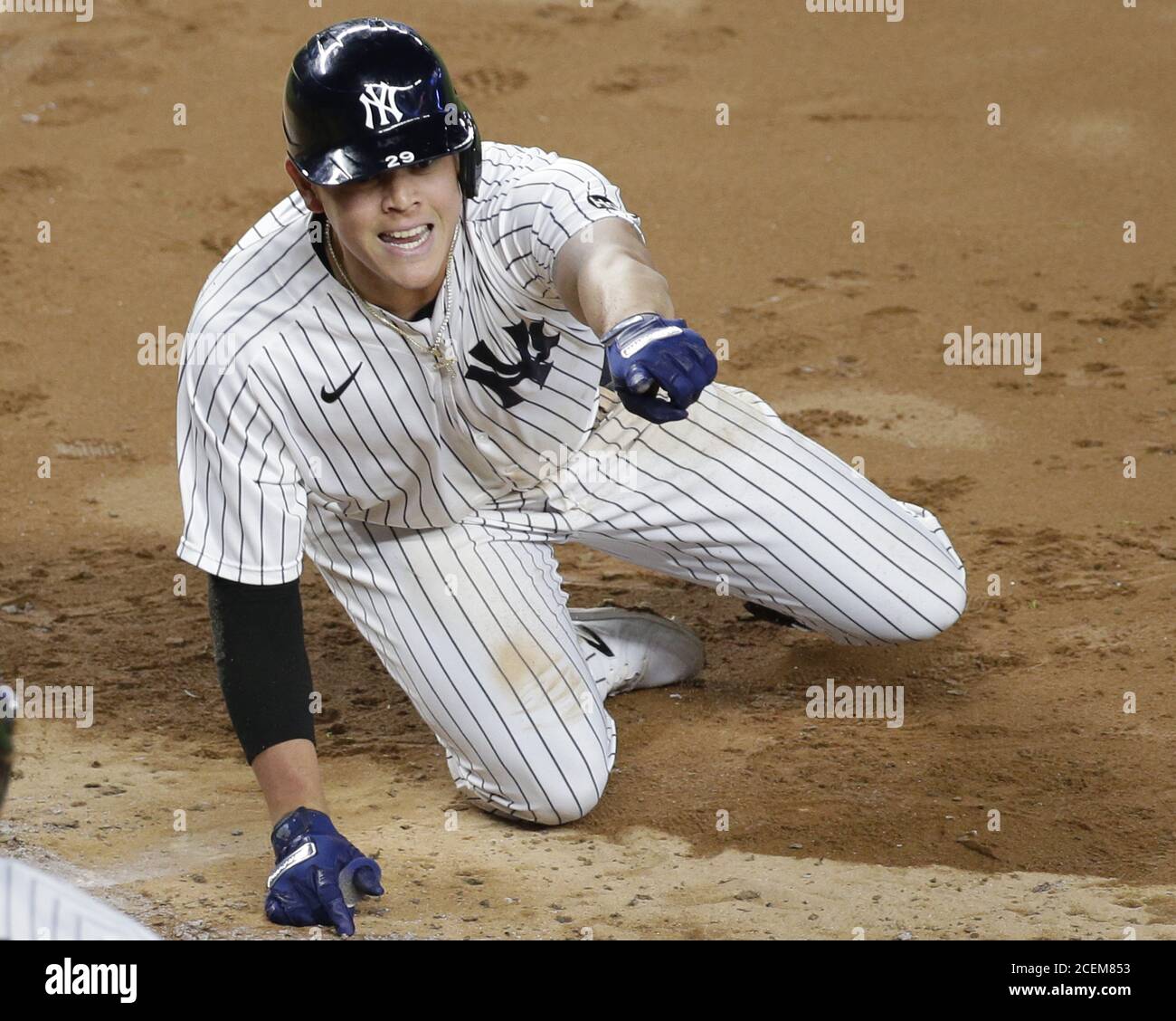 Bronx, United States. 01st Sep, 2020. New York Yankees Gio Urshela reacts after sliding into home plate and scoring a run on a play that brought him all the way home from an extra base hit due to an error in the sixth inning against the Tampa Bay Rays at Yankee Stadium on Tuesday, September 1, 2020 in New York City. Photo by John Angelillo/UPI Credit: UPI/Alamy Live News Stock Photo