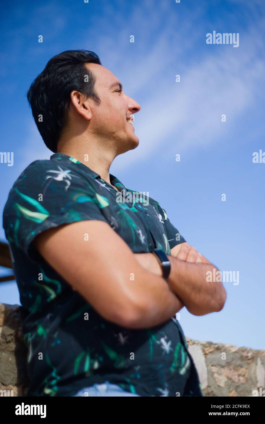 Man with positive and thoughtful attitude in an outdoor location. Stock Photo