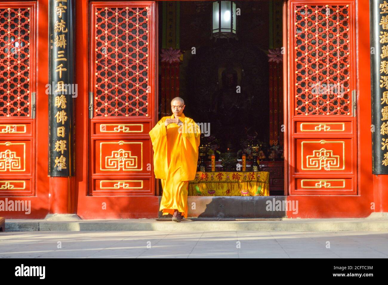 Beijing / China - February 2, 2014: Buddhist monk performing ritual at Fayuan Temple, constructed in 645, one of the oldest Buddhist temples in Beijin Stock Photo