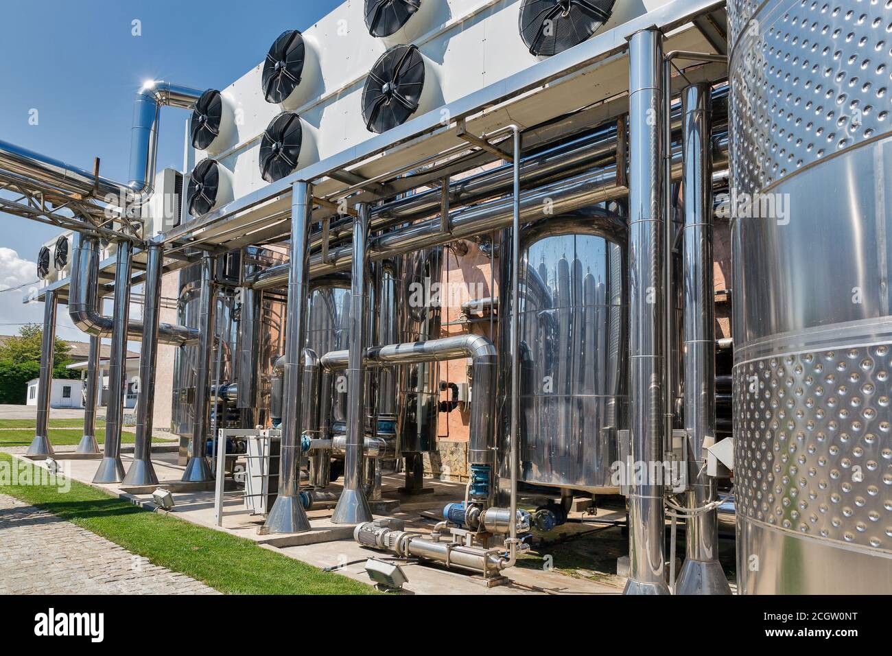 Stainless steel reservoirs for wine at modern winery outdoor closeup Stock Photo