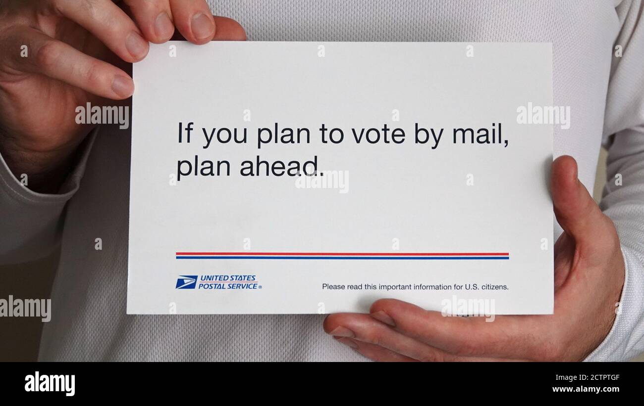 Los Angeles, CA / USA - Sept. 24, 2020: An official United States Postal Service USPS mailer reads: “If you plan to vote by mail, plan ahead.” Stock Photo