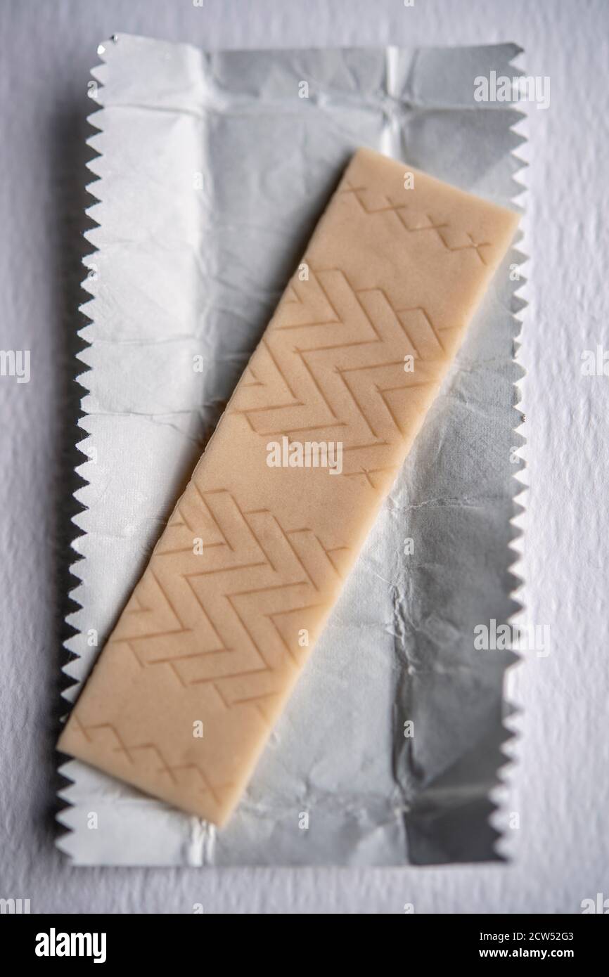 Stick of chewing gum on a piece of silver paper Stock Photo