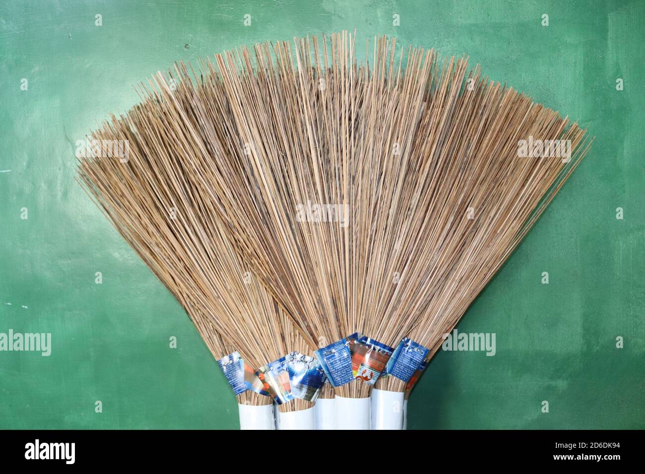 A bundle of handmade brooms which are made by coconut sticks. These are the most famous outdoor cleaning broom in Sri Lanka. This is one destination. Stock Photo