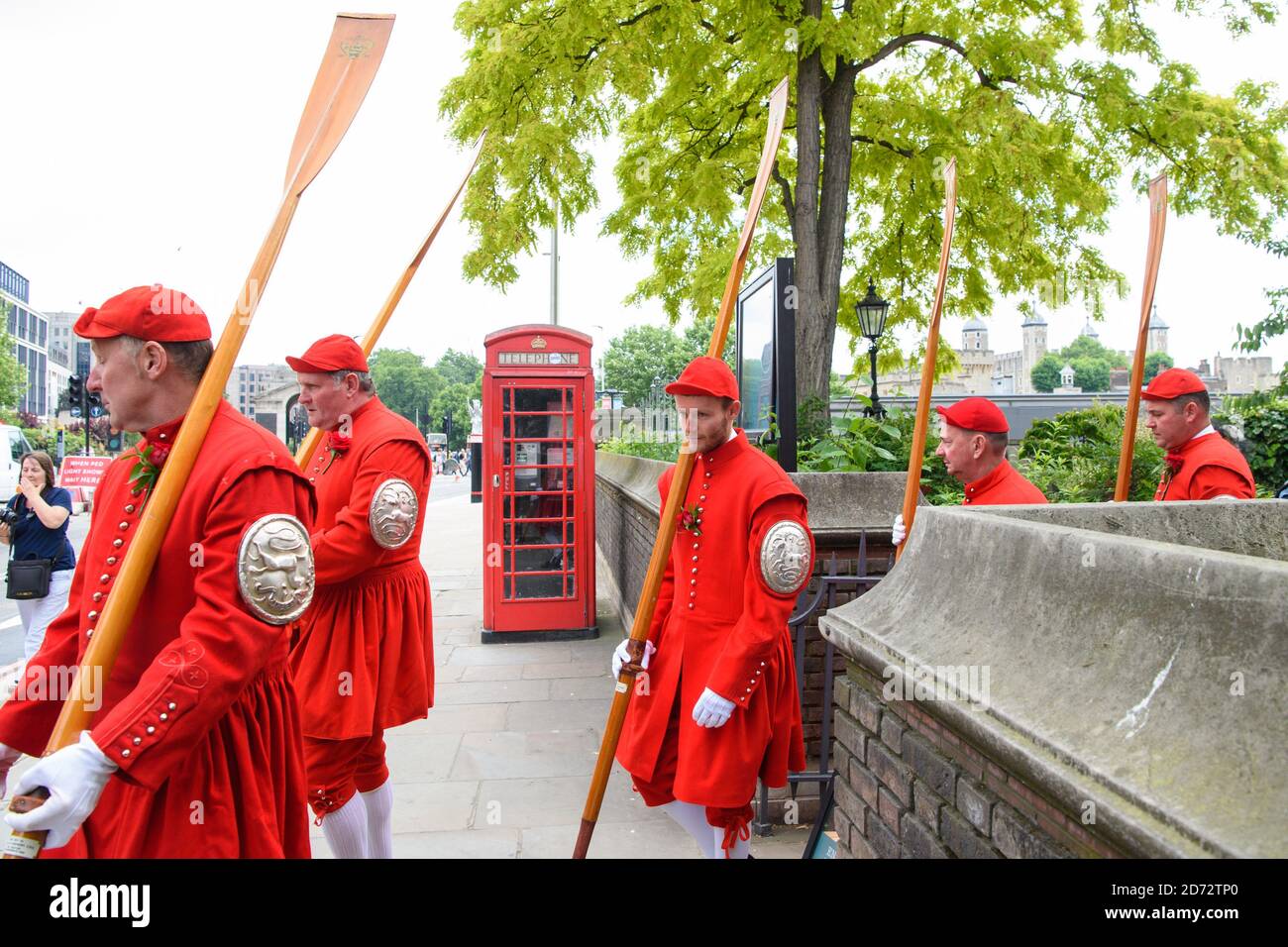 Members of the Company of Watermen and Lightermen of the River Thames leave the churchyard of All Hallows by the Tower in London, during the Knolly's Rose Ceremony. The ceremony, which dates back to 1381, sees a peppercorn rent of a single rose being paid annually to the Lord Mayor, after  soldier Sir Robert Knollys of Seething Lane built an illegal footbridge over the road to his rose garden. Picture date: Wednesday 20th June, 2018. Photo credit should read: Matt Crossick/ EMPICS Entertainment. Stock Photo