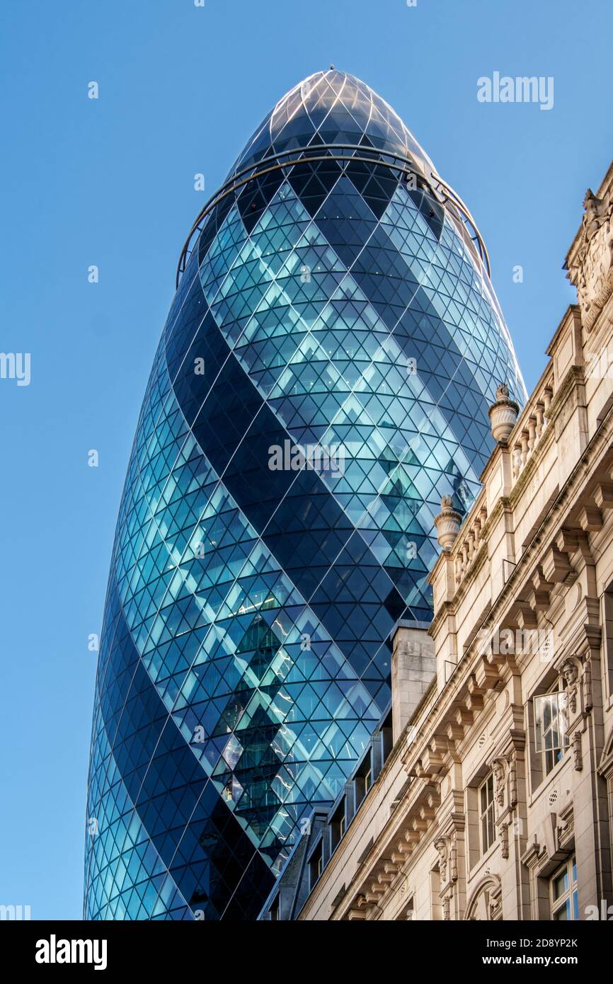 The Gherkin (30 St. Mary Axe) by Norman Foster, neoclassical 19th Century office buildings, City of London, downtown, financial district, London, UK Stock Photo