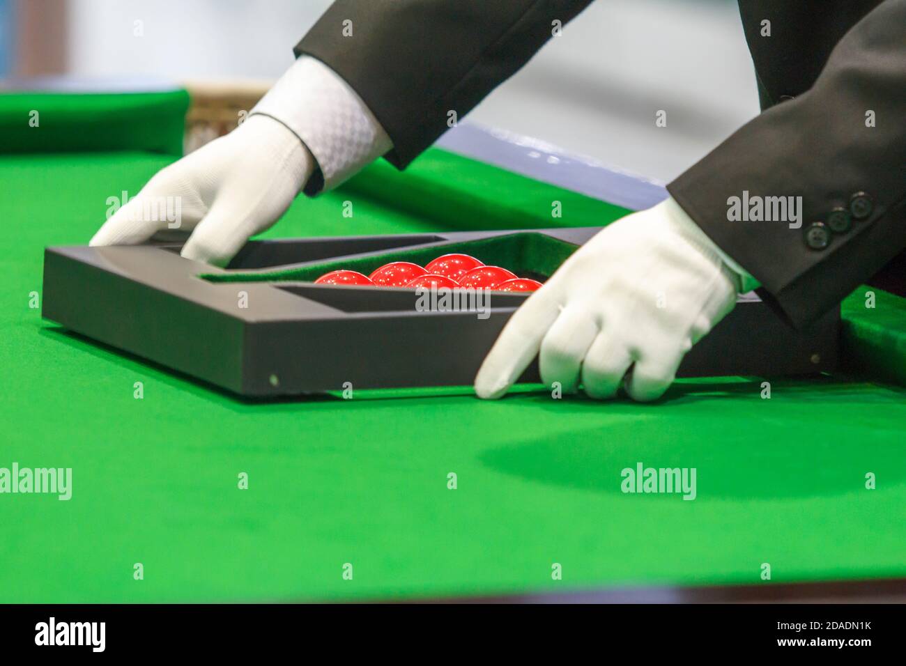 snooker referee set up ball for new game Stock Photo