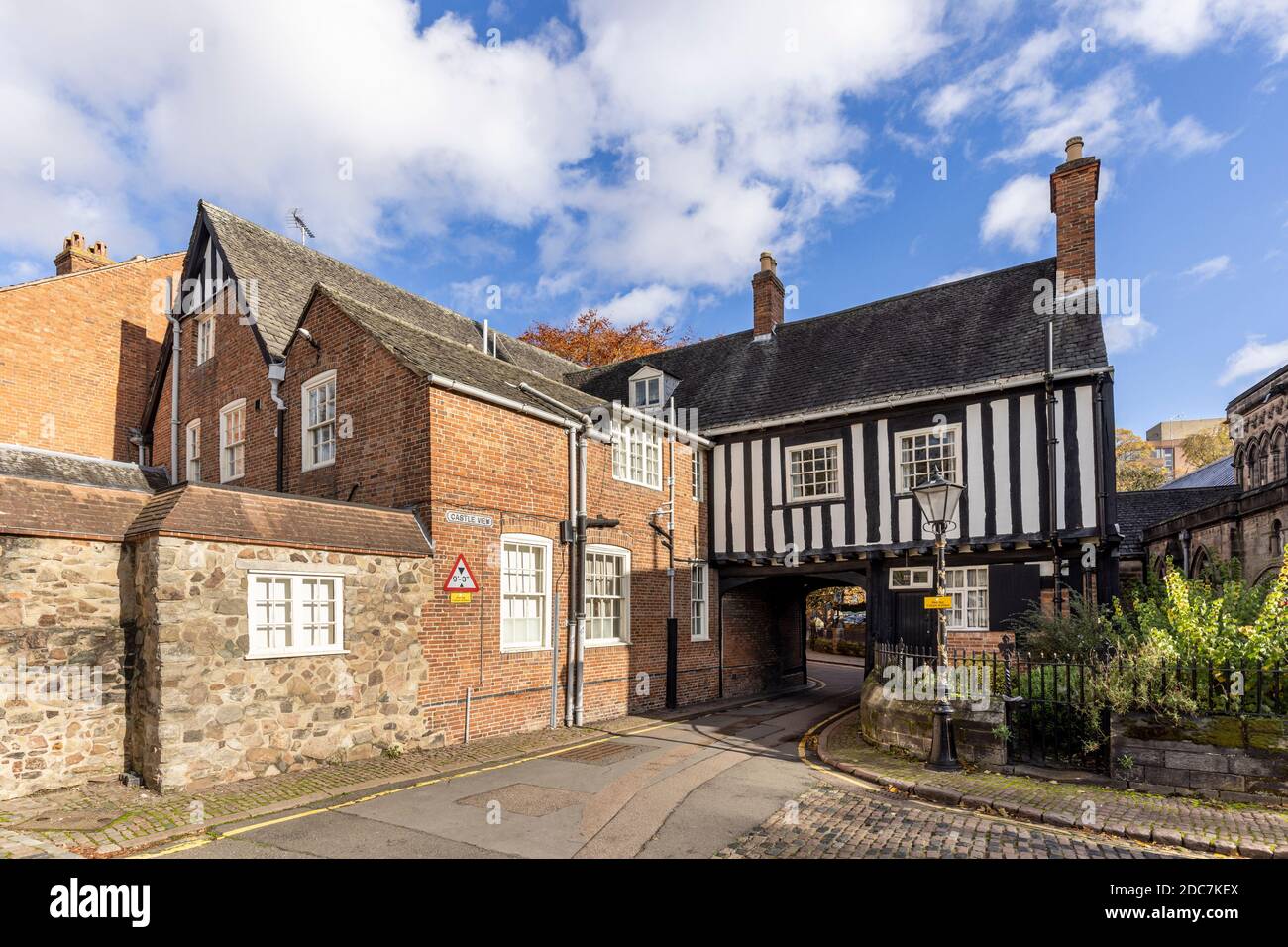 The medieval timbered Castle Gate House (dating from the 15th century, 1445) with a road passing underneath in Leicester Stock Photo