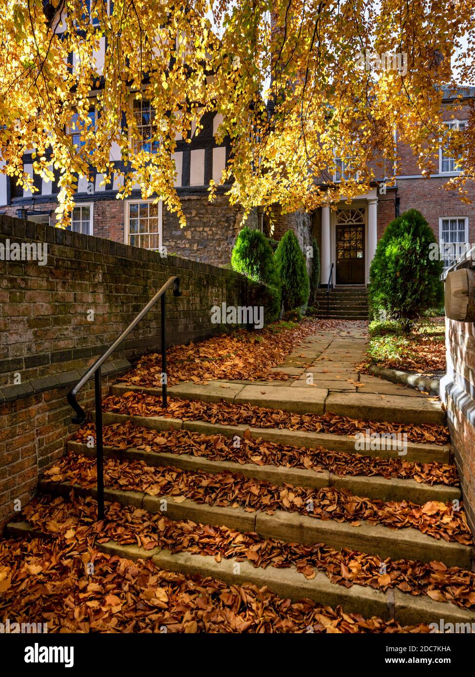 Autumn leaves cover the steps leading to Castle House and the adjoining gatehouse, Leicester Stock Photo