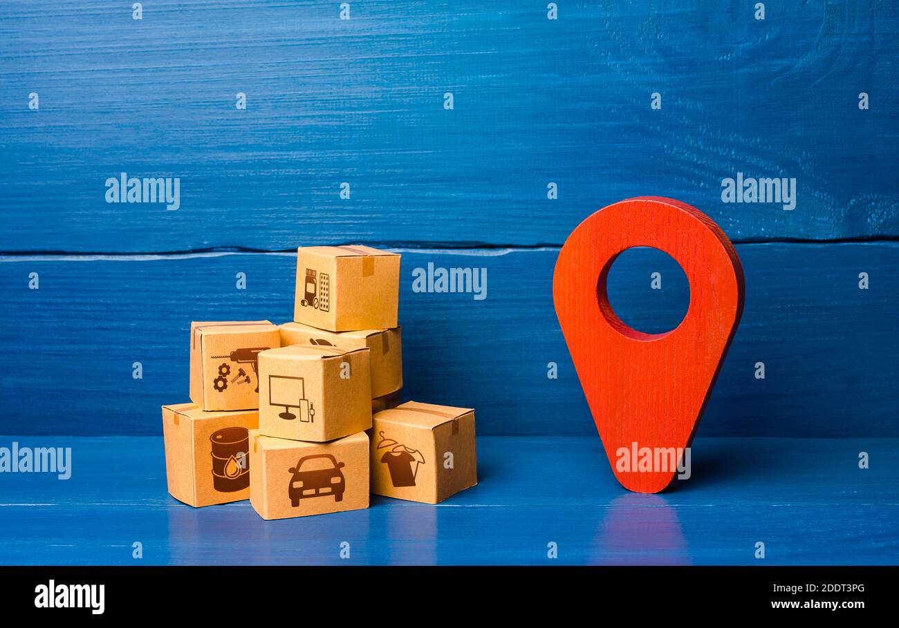 Red location pointer symbol and cardboard boxes. Transport logistics distribution delivery of goods to consumer customer. Adjusting the business to th Stock Photo