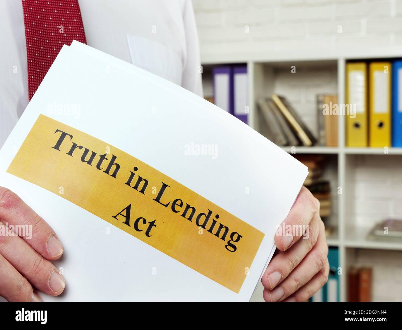 The man shows the Truth in Lending Act TILA. Stock Photo