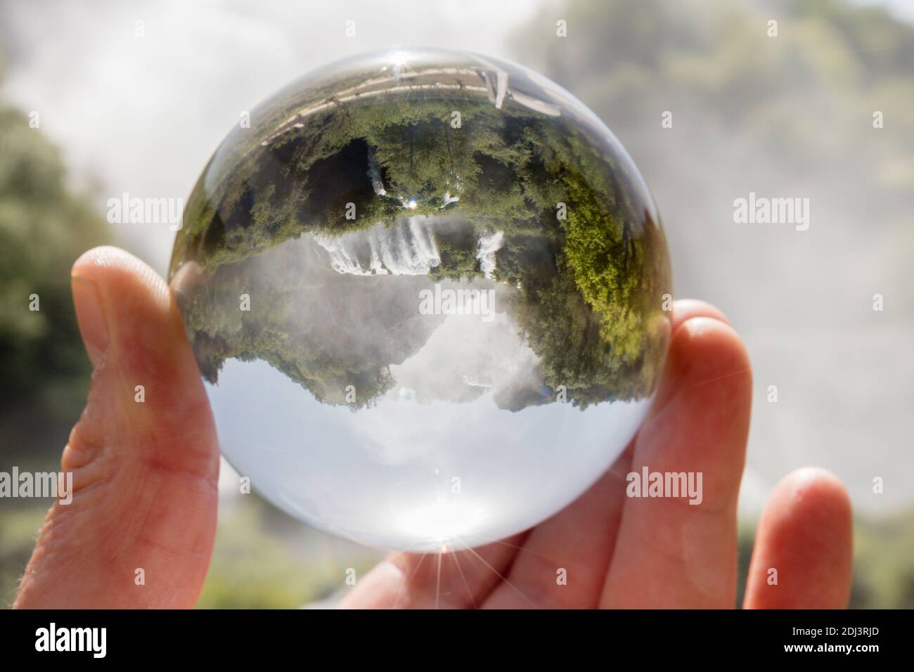 Marmore Falls, Umbria, Italy (Cascata delle Marmore) photographed through a glass lensball. Tallest man-made waterfall in the world. Stock Photo